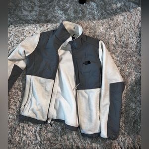 White and grey north face zip up jacket
